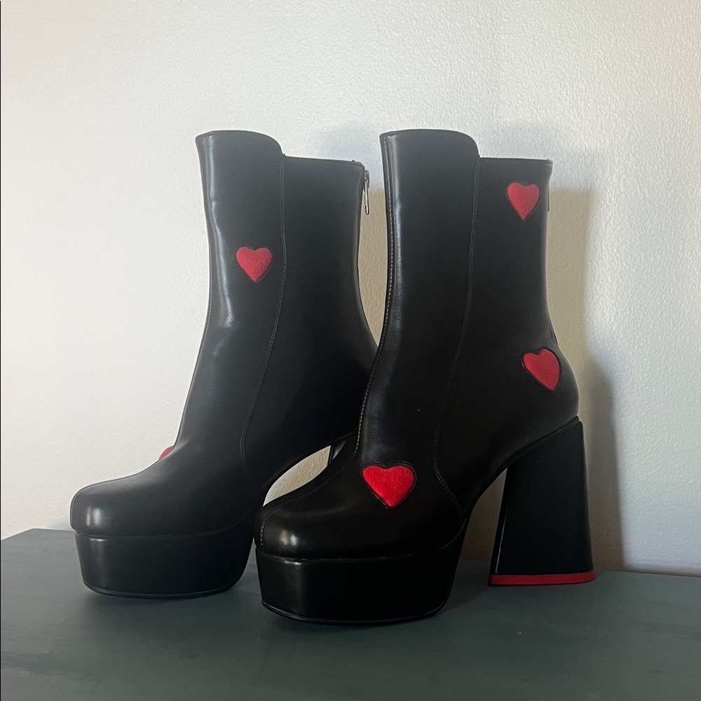 Stylish Black Heeled Boots with Red Heart Details